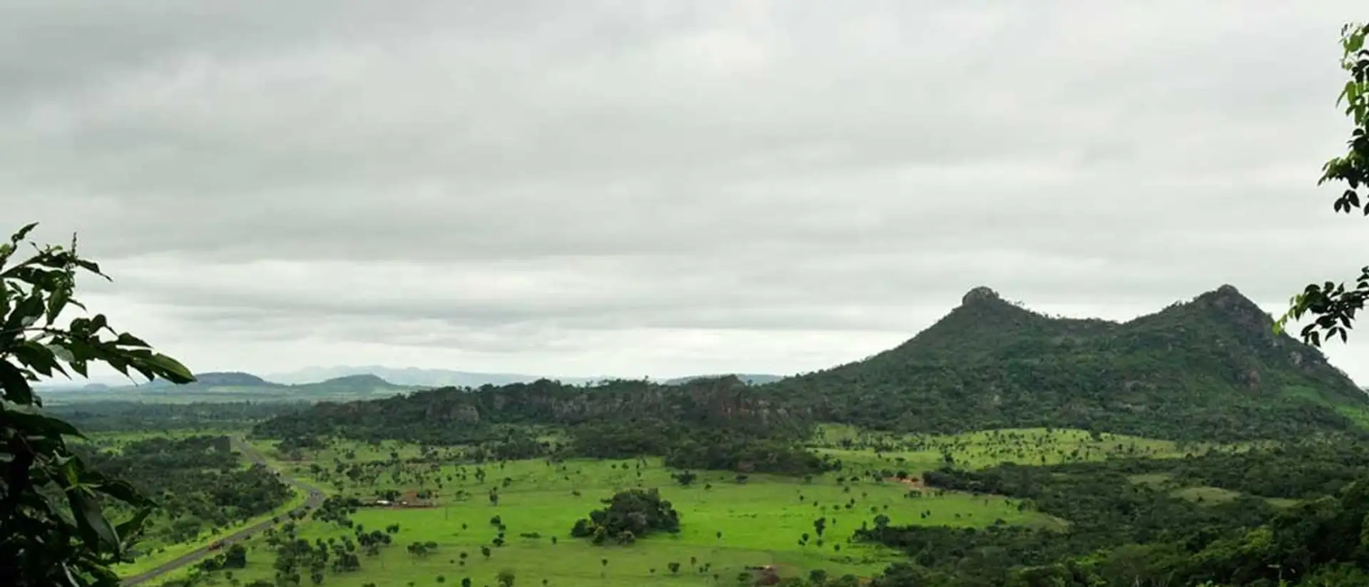 Rolling green hills and rock formations at Cerro Cora National Park in Paraguay