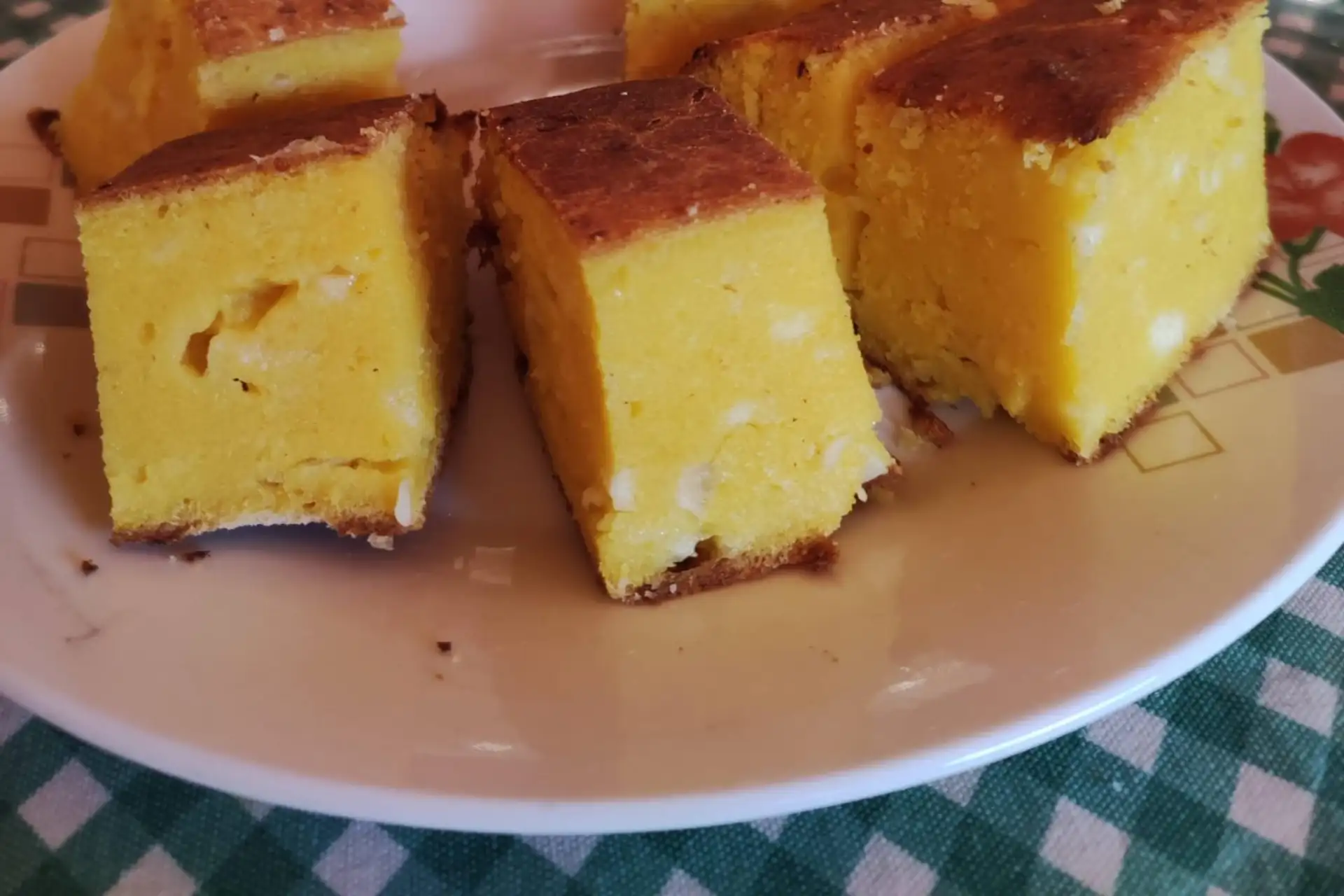 Slices of traditional Paraguayan sopa paraguaya cornbread served on a plate